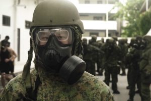 Captain (CPT) Tay Min Yi wearing Mission Oriented Protective Posture (Mopp) 4 attire