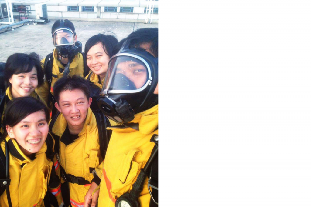 group photo of scdf officers in bunker gear during fitness training