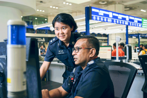 ICA officer Hazel Wong speaking to a fellow officer at the Woodlands Checkpoint