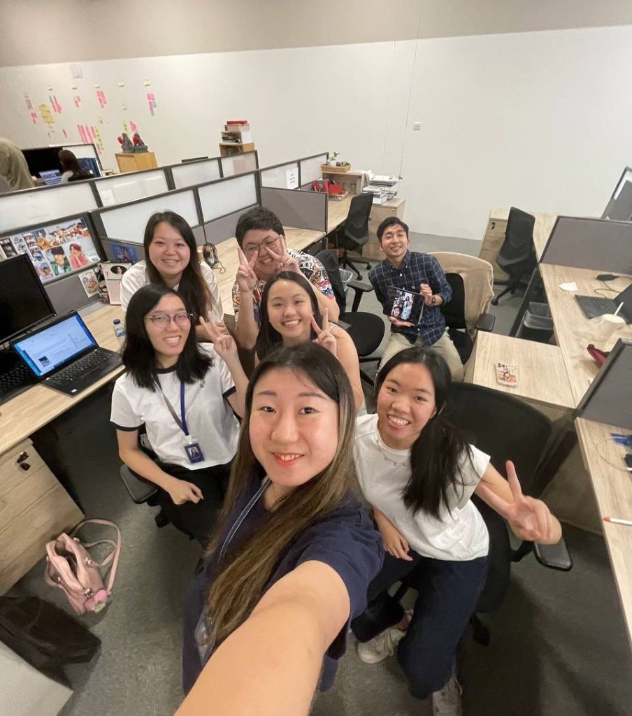 SPH Media Scholar Chong Xin Wei with her team at The Business Times newsroom