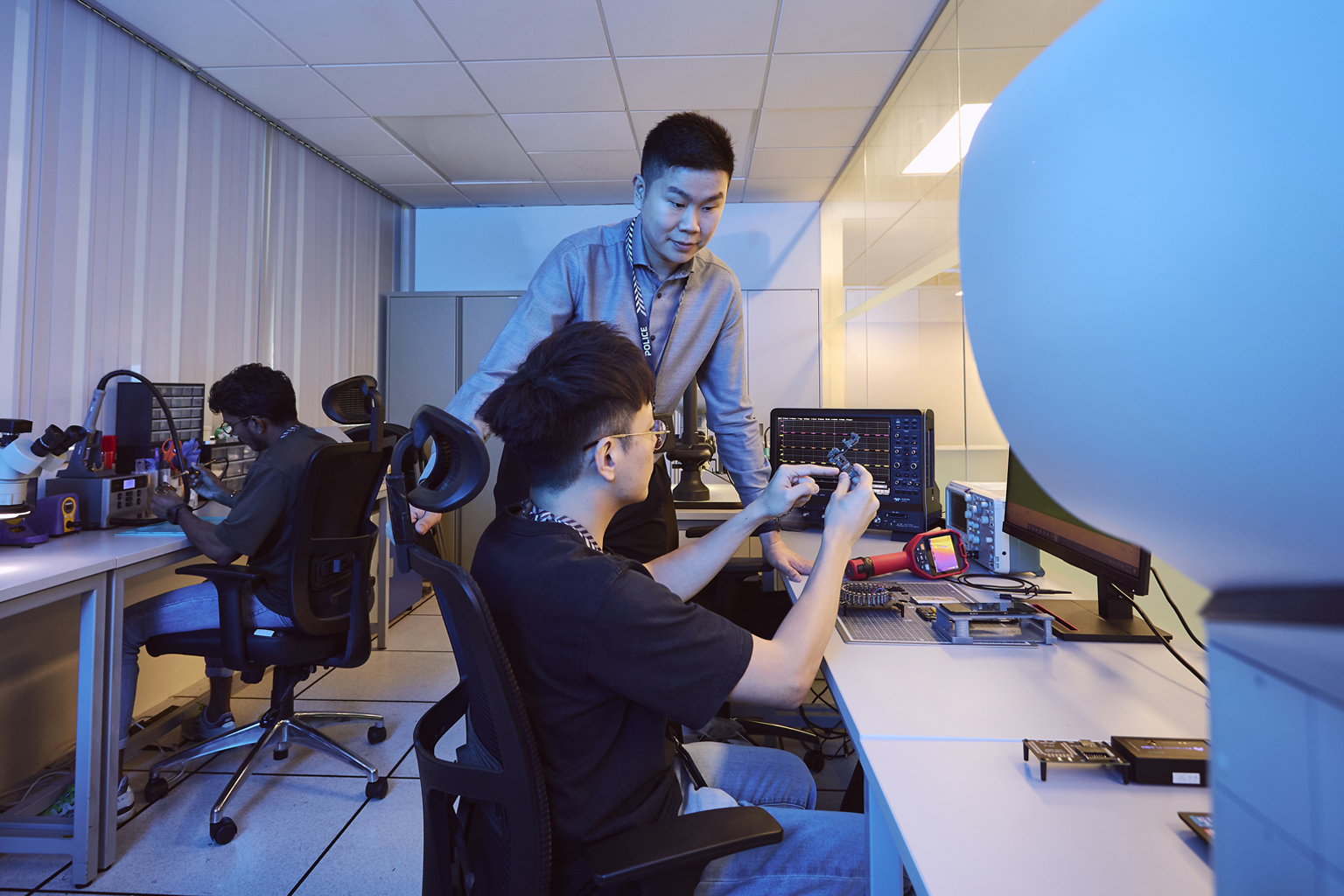 CID officer Gregory Kang in his digital lab working on cybercrime and scams with his team