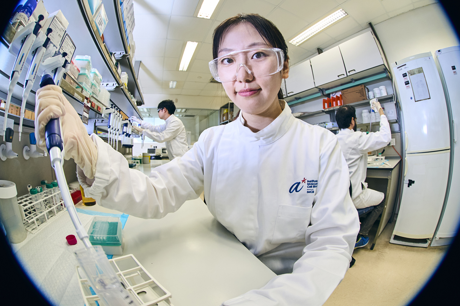 ASTAR scientist Dr Liu Shuang doing experiments at her lab