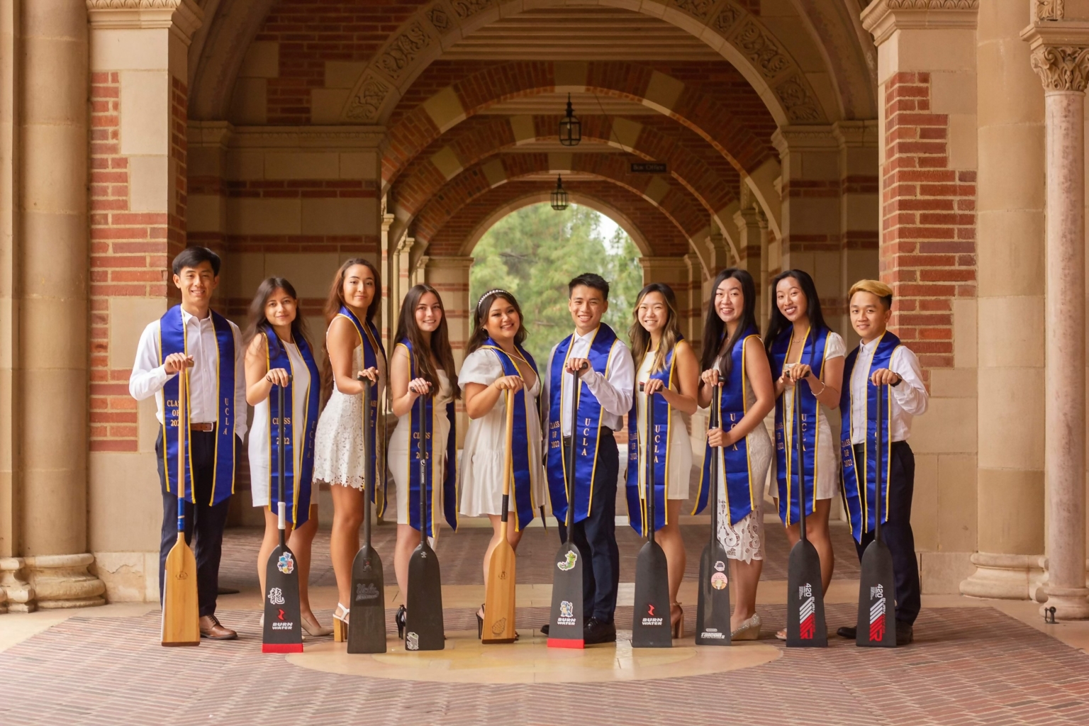 nicole pictured fourth from right in a graduation photo with her university of california los angeles dragon boat teammates in 2022 an experience where she made international friends and learned to weigh diverse perspectives that now inform her policy work