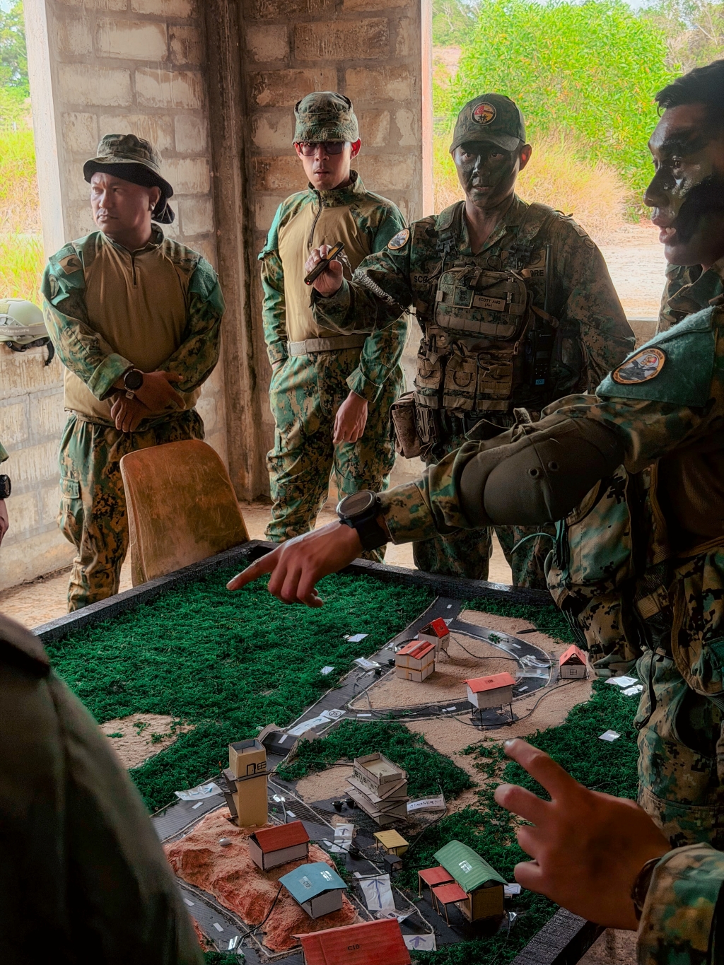 ltc scott ang (second from right) during field operation, commanding 1st battalion of singapore infantry regiment