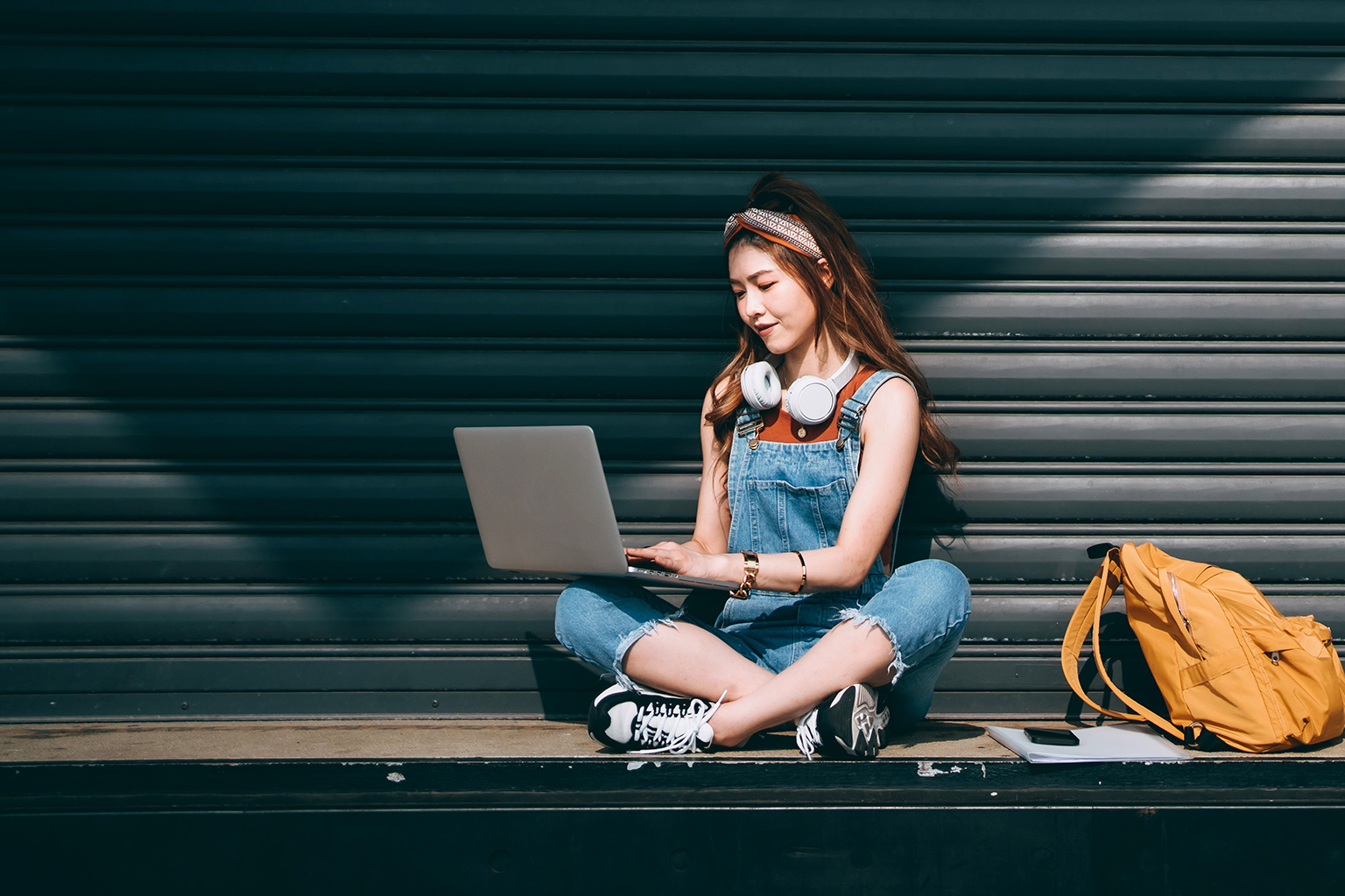 student preparing a scholarship application on a laptop