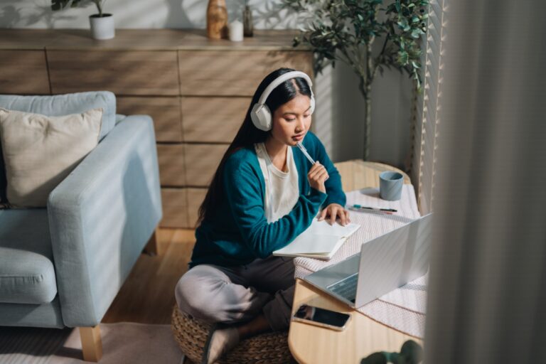 young female student thinking about what to include in her scholarship essay