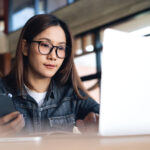 young woman looking at an online scholarship