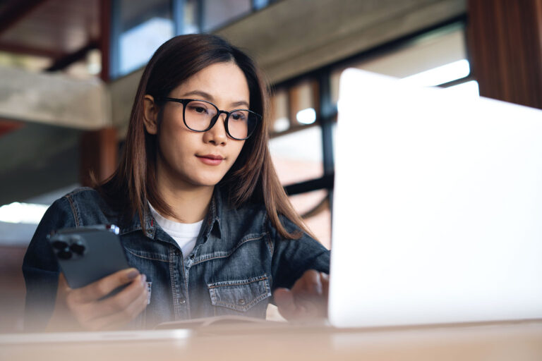 young woman looking at an online scholarship