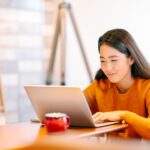 young student searching for scholarships in singapore